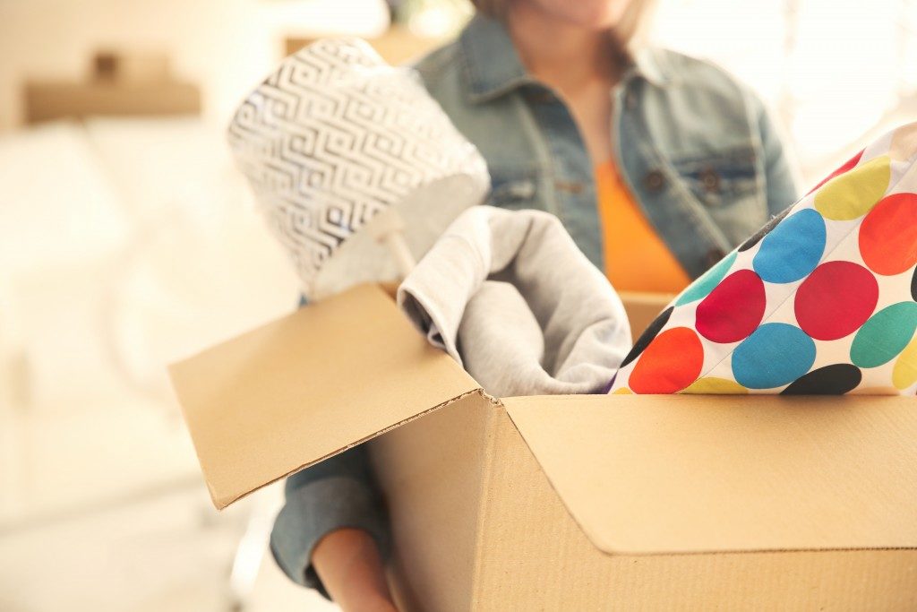 Woman holding an open box